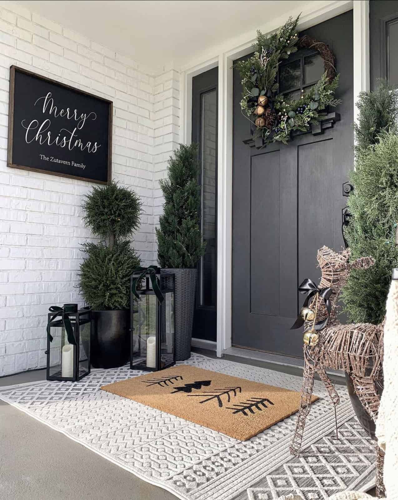 christmas-decorated-front-porch-black-and-white-with-traditional-greenery