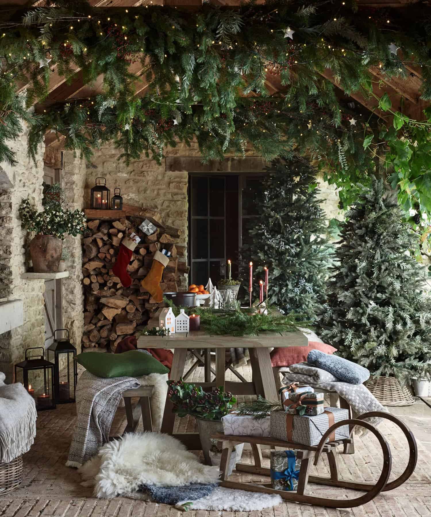 christmas-decorated-porch-with-trees-and-garland