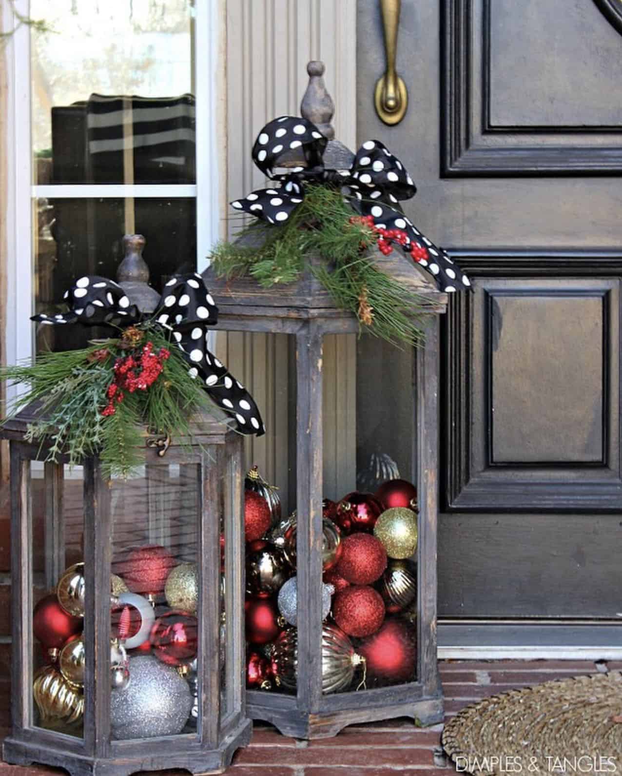 christmas-decorated-front-porch-with-tall-glass-lanterns-and-ornaments