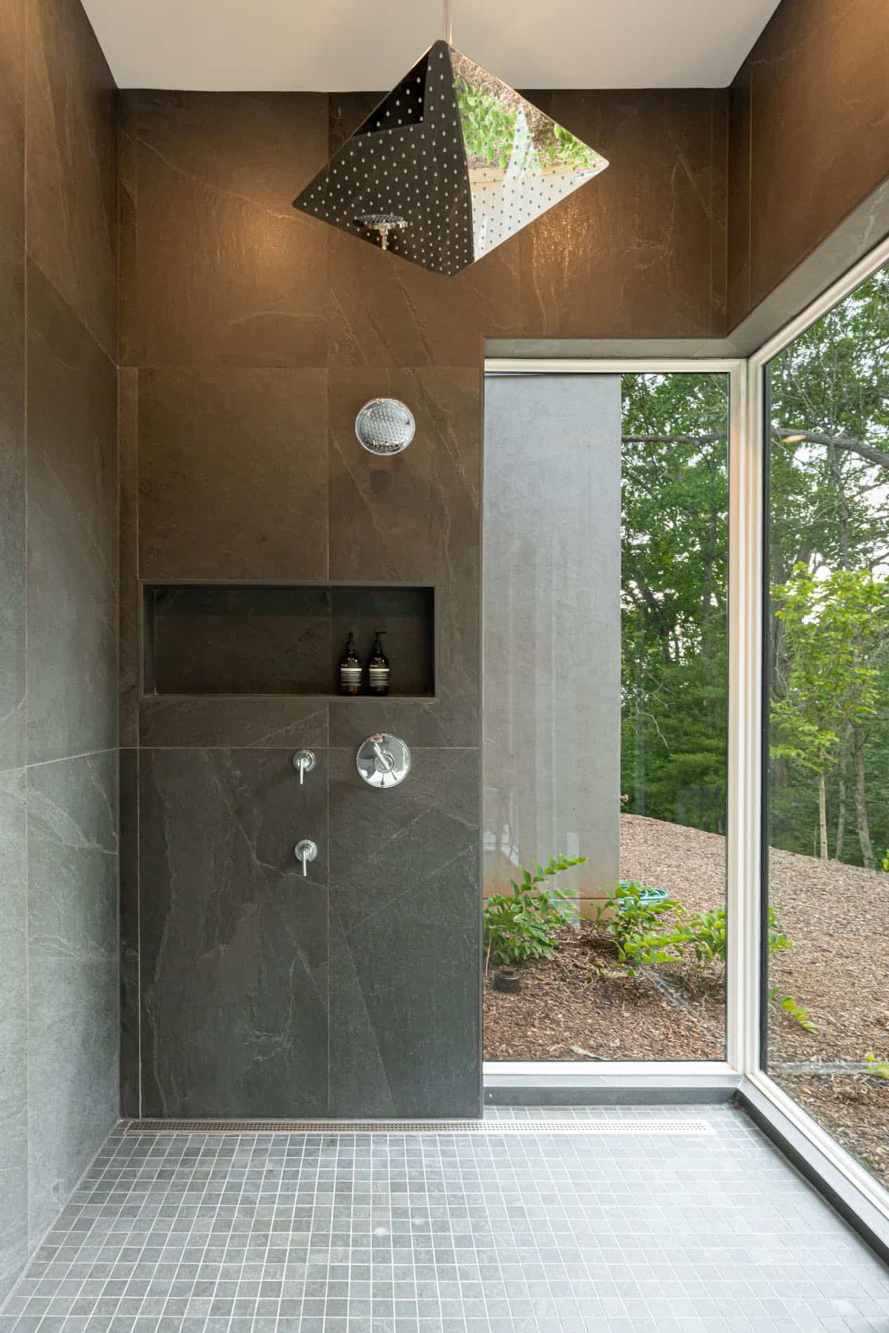 modern-bathroom-shower-with-walls-of-glass-and-nature-views