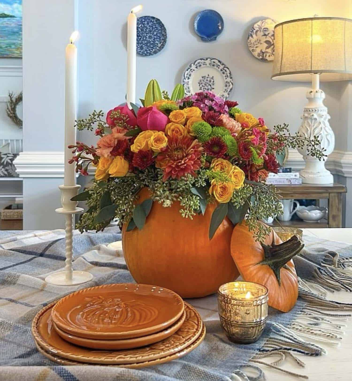floral pumpkin centerpiece on a Thanksgiving decorated table