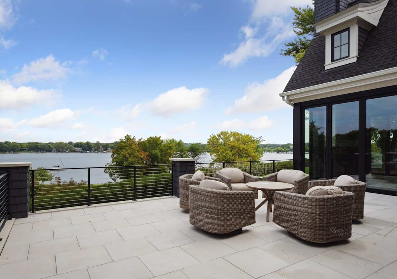 transitional-style-home-exterior-patio-looking-out-to-lake-minnetonka