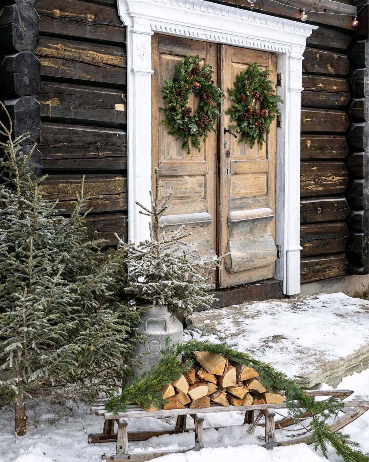 christmas-cabin-with-christmas-wreaths-on-the-doors