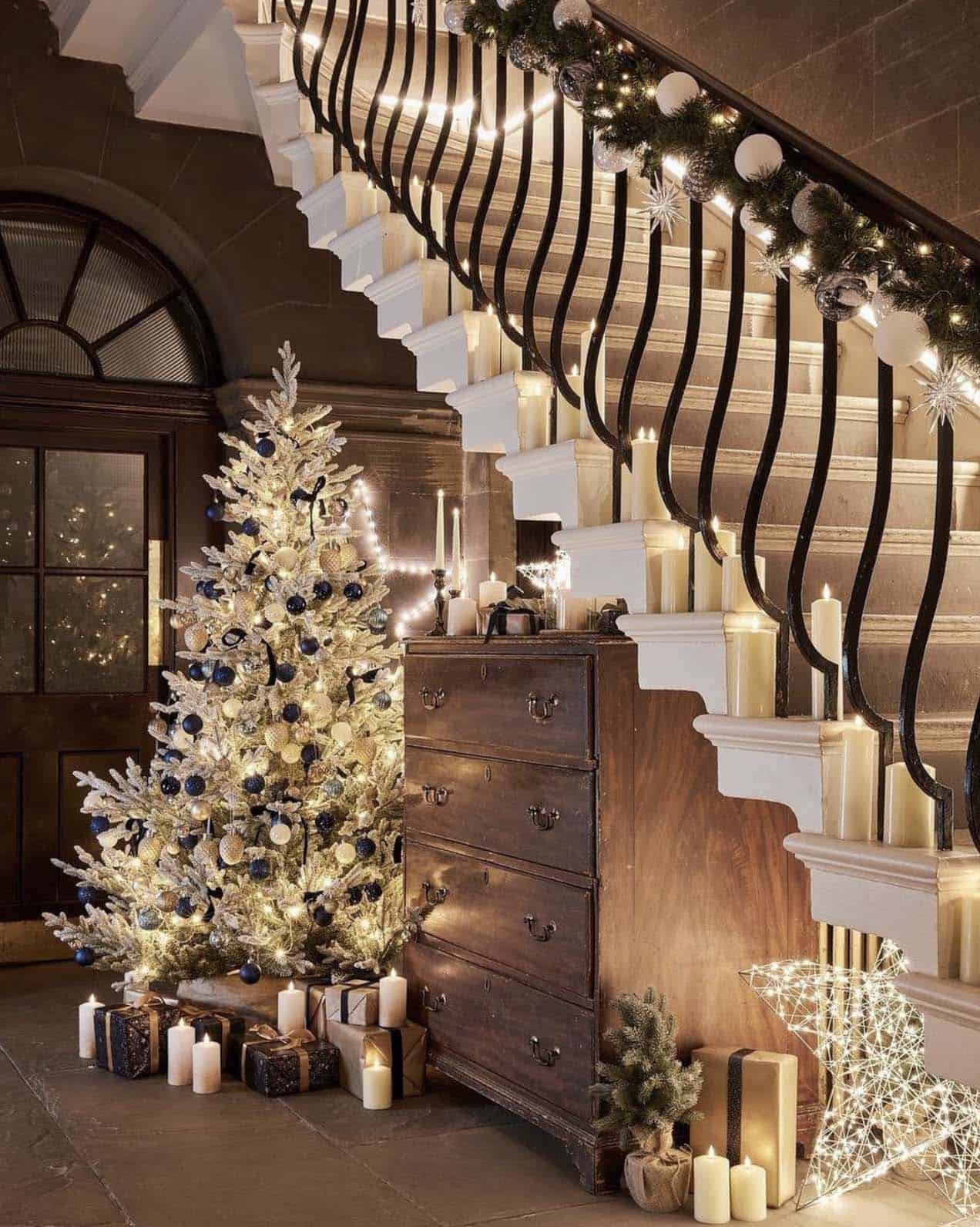 staircase-with-garland-and-string-lights-and-a-christmas-tree