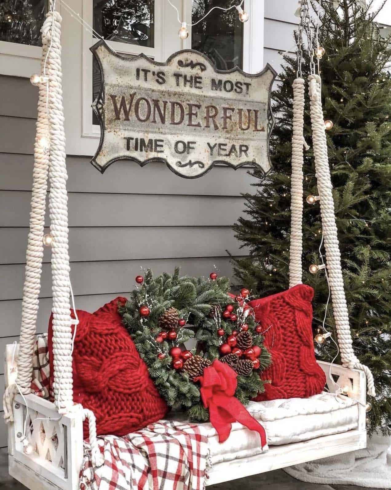 outdoor-porch-swing-with-red-and-green-christmas-decorations
