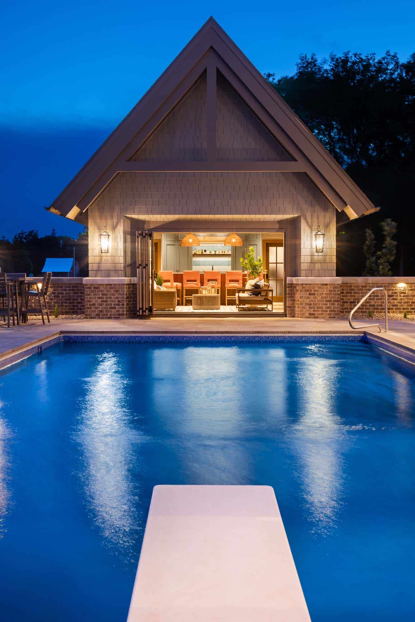pool-house-and-swimming-pool-at-dusk