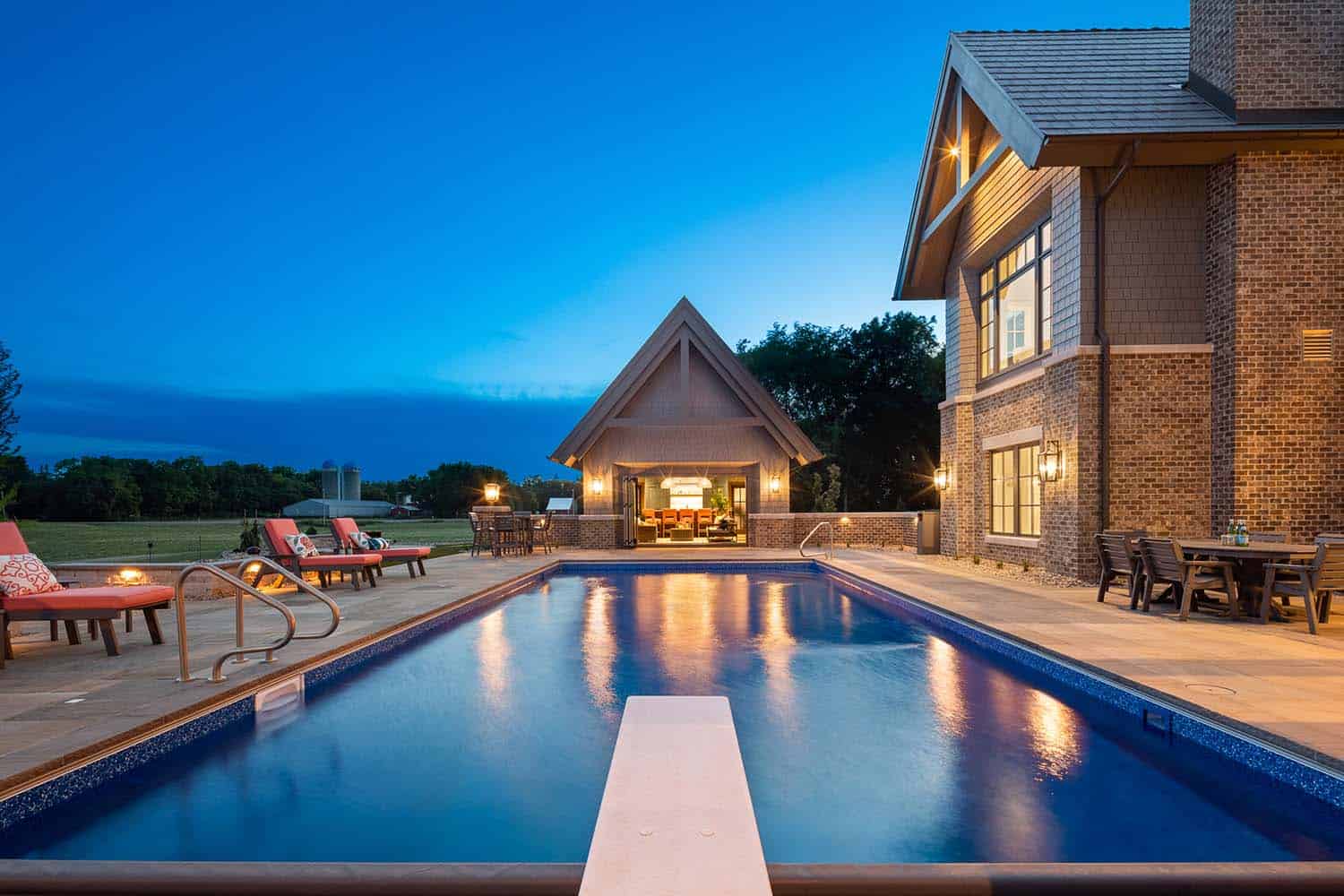 shingle-style-lodge-exterior-with-a-pool