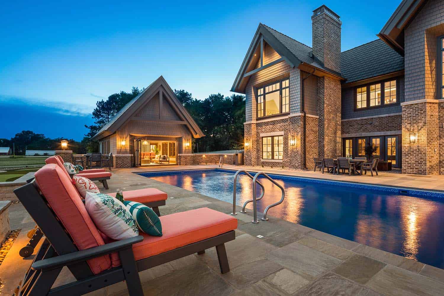 shingle-style-lodge-exterior-with-a-pool