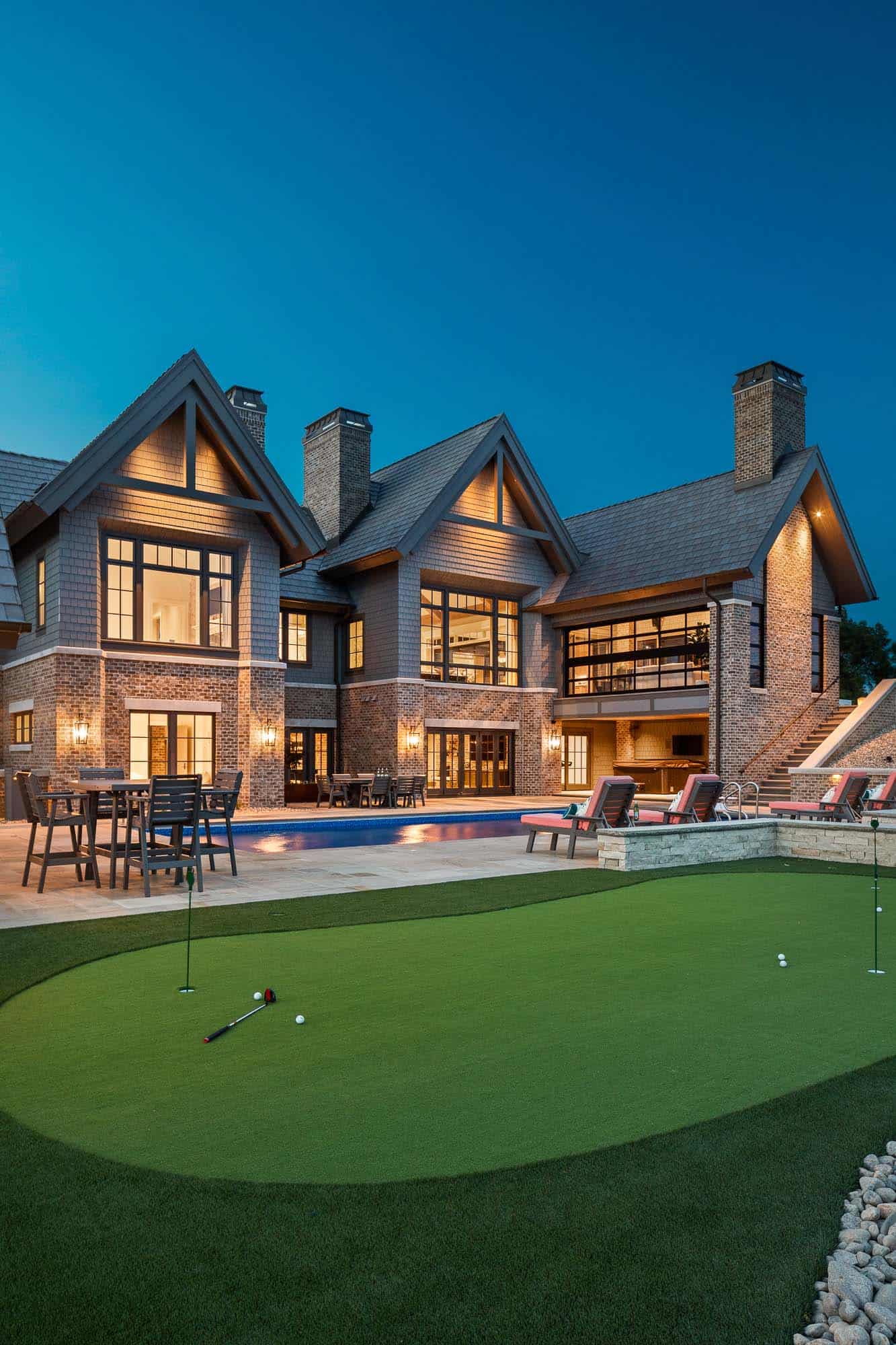 shingle-style-lodge-exterior-with-a-putting-green