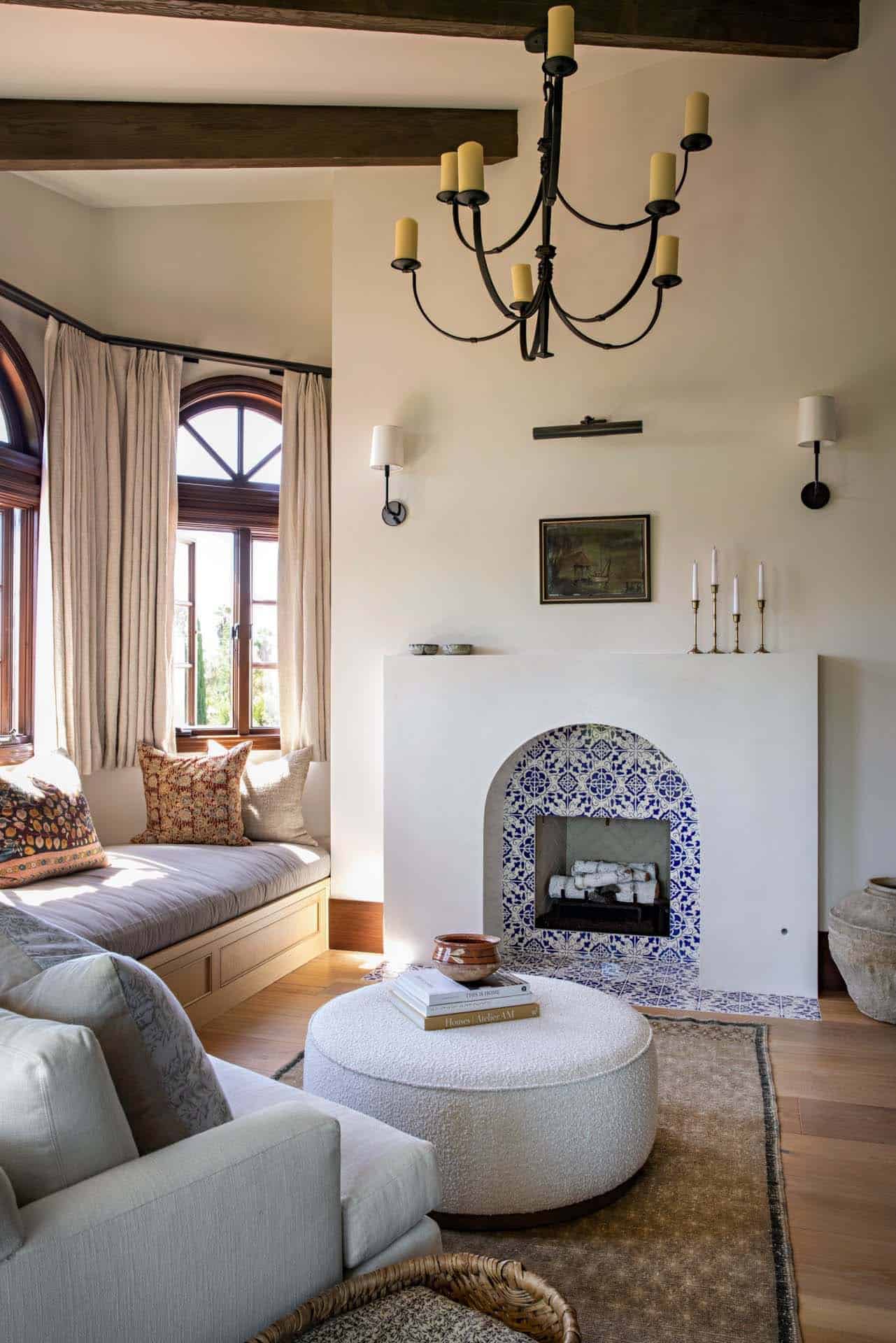 mediterranean-style-bedroom-sitting-room-with-a-fireplace