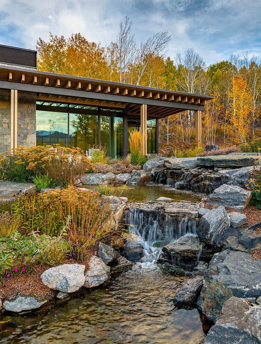 modern-mountain-home-landscape-with-a-waterfall