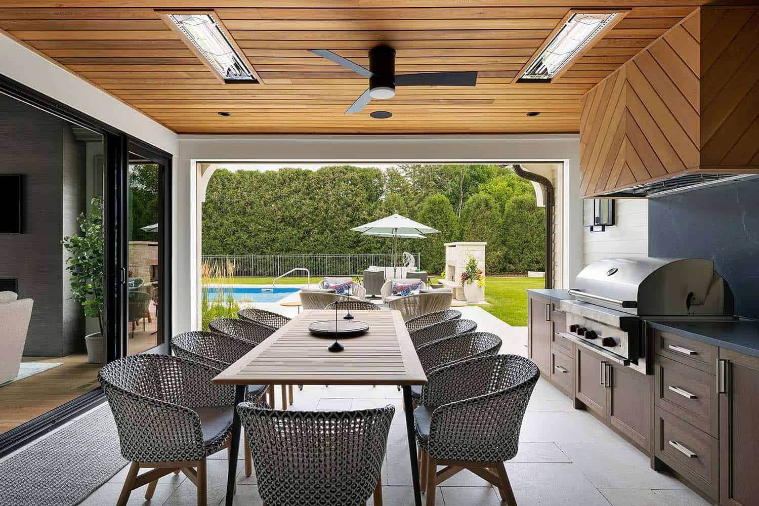 contemporary-outdoor-covered-porch-with-a-grill-and-dining-table