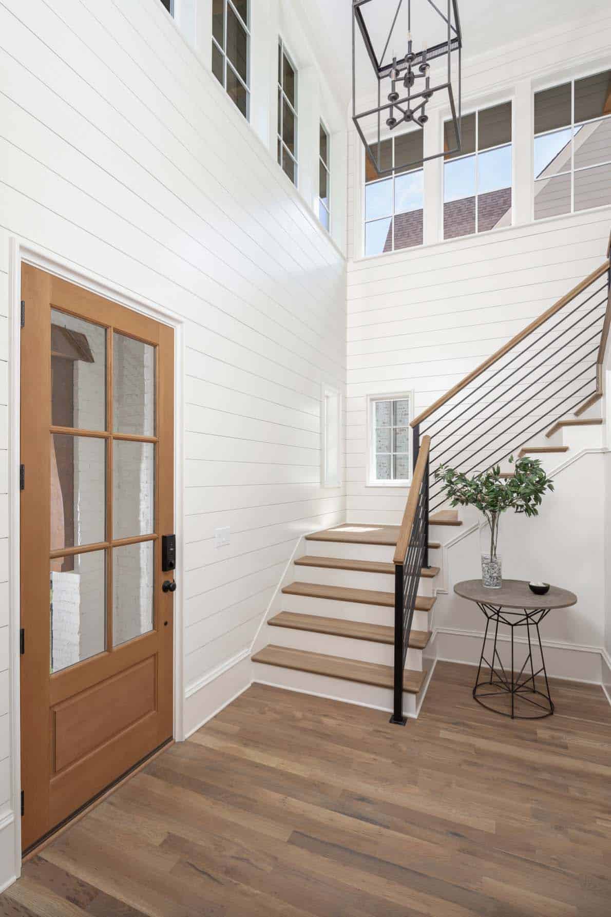 dutch-colonial-inspired-home-entry-with-a-staircase