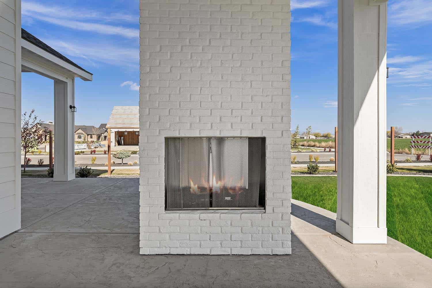 modern-farmhouse-style-covered-patio-with-an-outdoor-fireplace