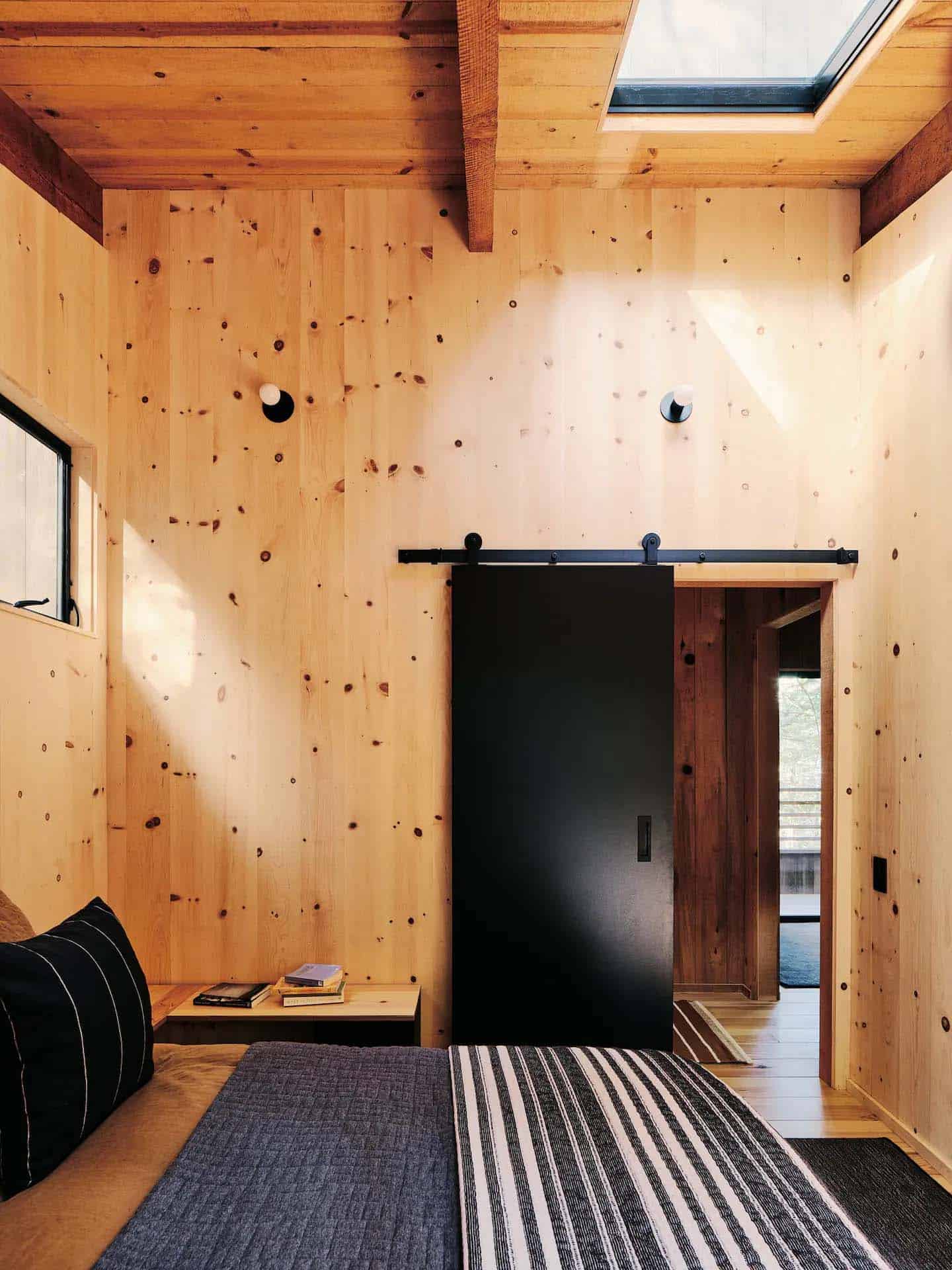 modern-cabin-bedroom-with-a-sliding-barn-door