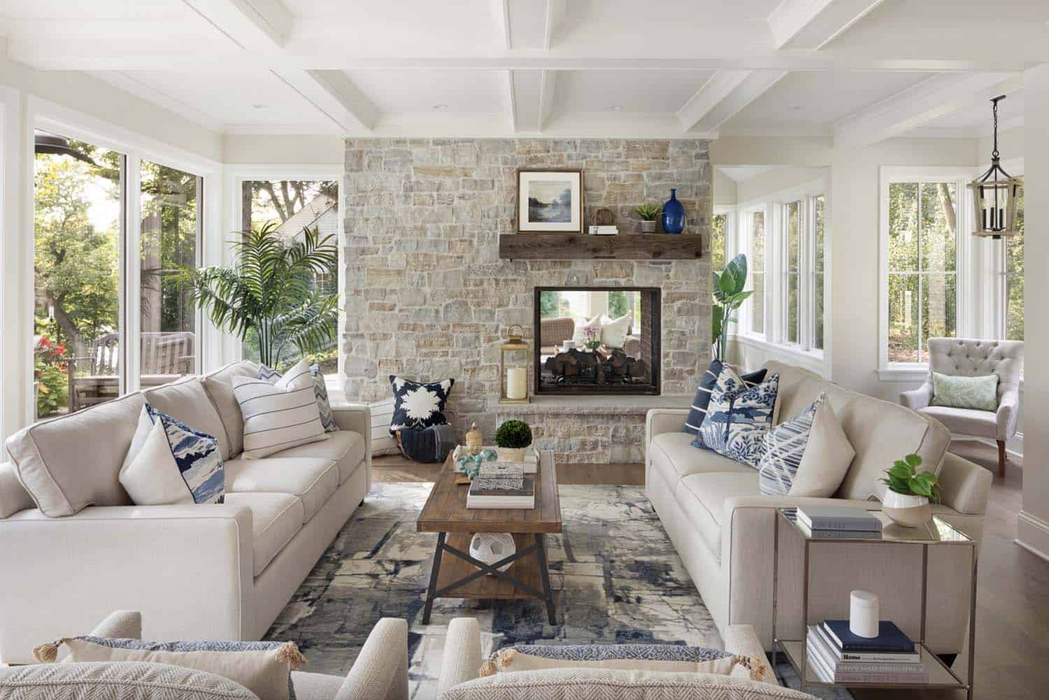 transitional-living-room-with-a-dual-sided-fireplace