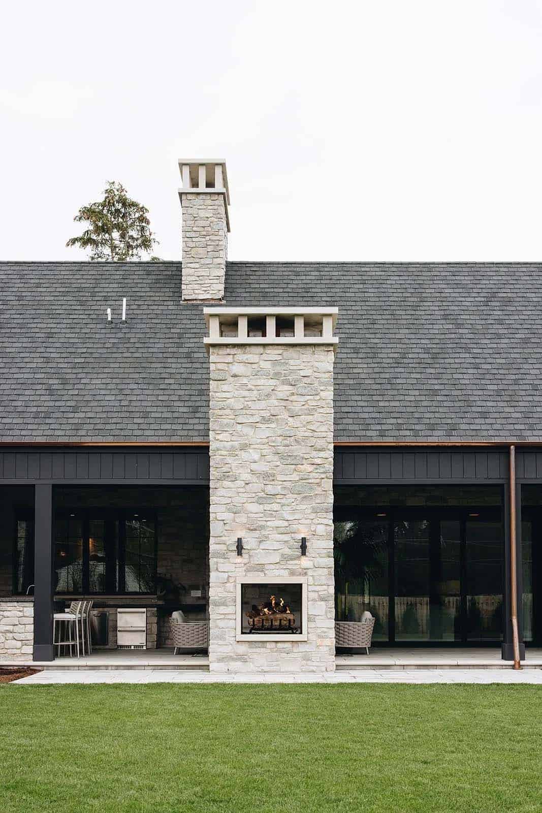 transitional-style-home-exterior-with-a-fireplace