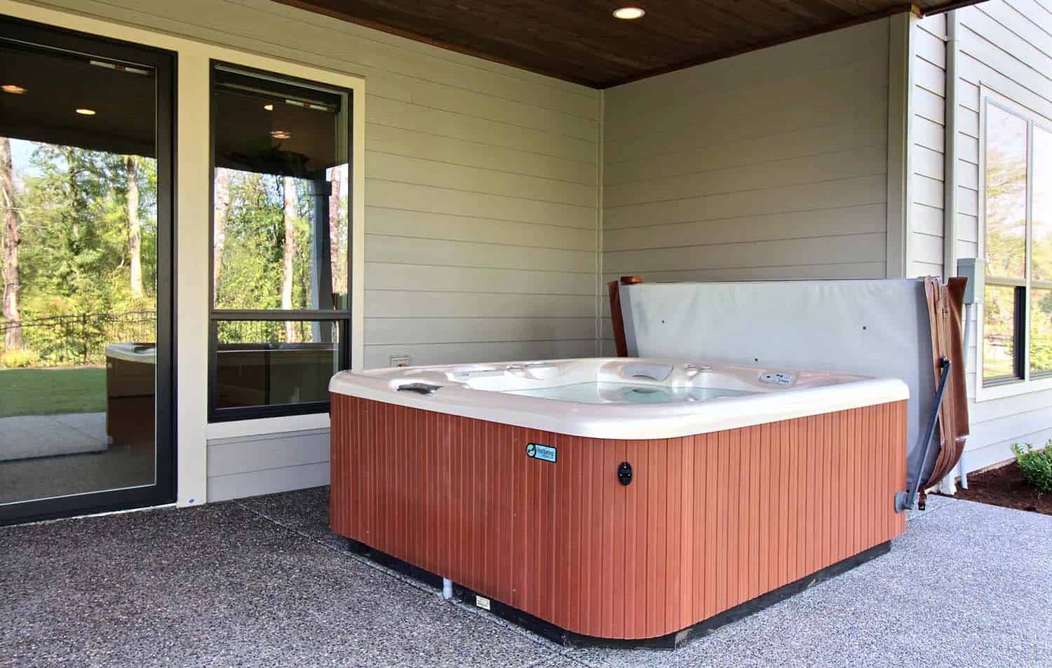 craftsman-home-exterior-patio-with-a-hot-tub
