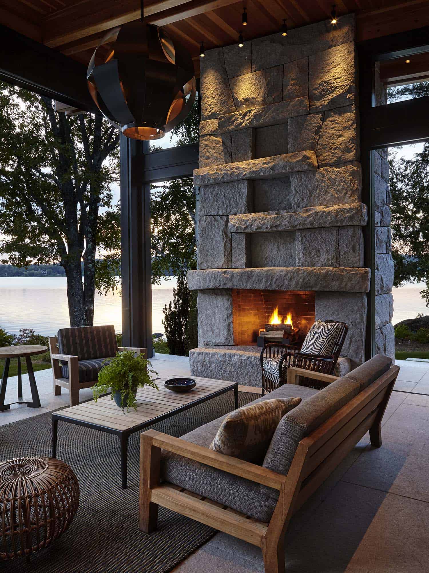 lake-house-covered-outdoor-patio-with-a-fireplace