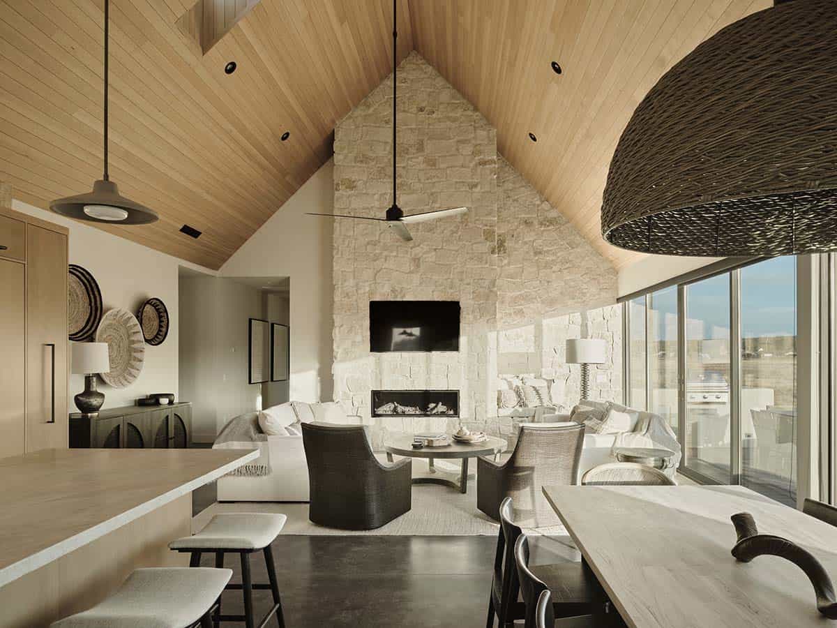 modern-scandinavian-living-room-with-a-limestone-fireplace