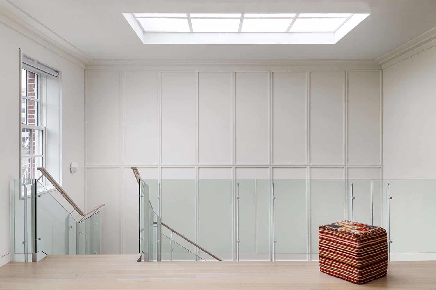modern-staircase-upstairs-landing-with-a-skylight