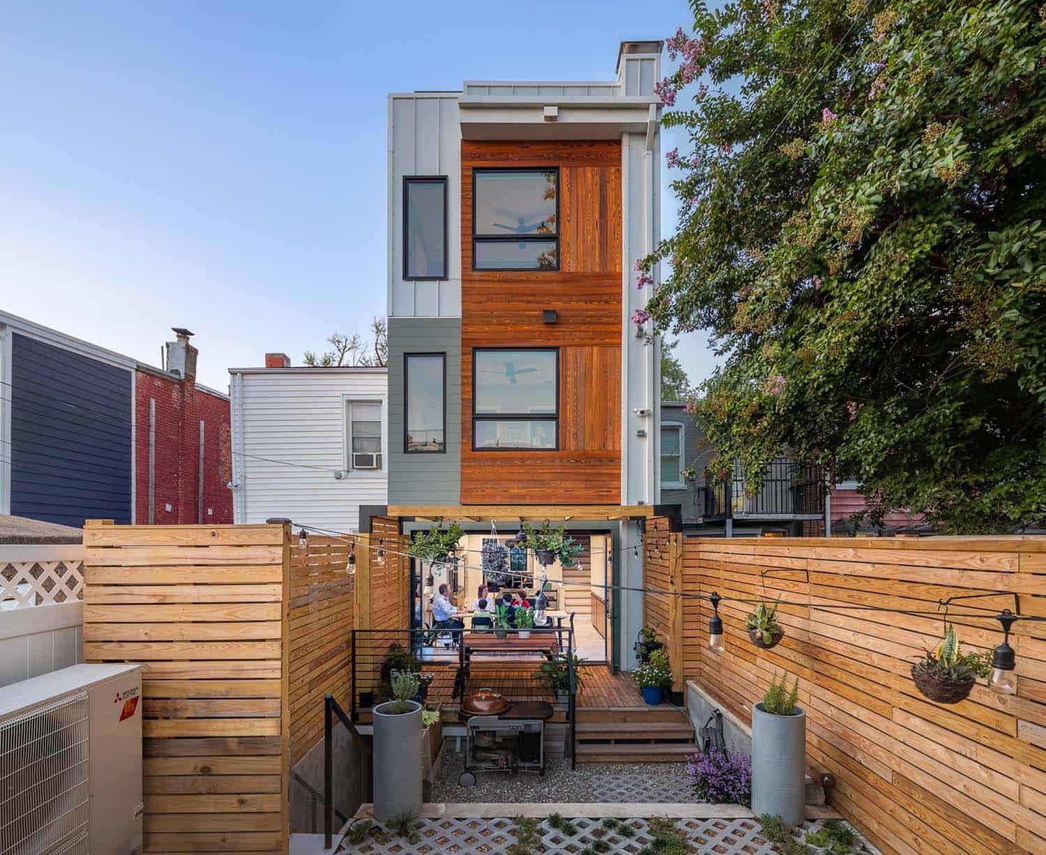 net-zero-row-house-exterior-backyard