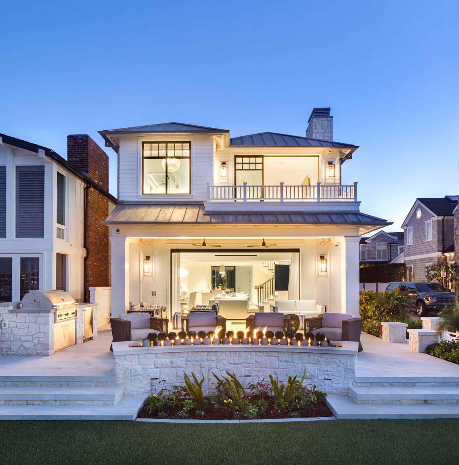 transitional-style-bayfront-home-exterior-at-dusk