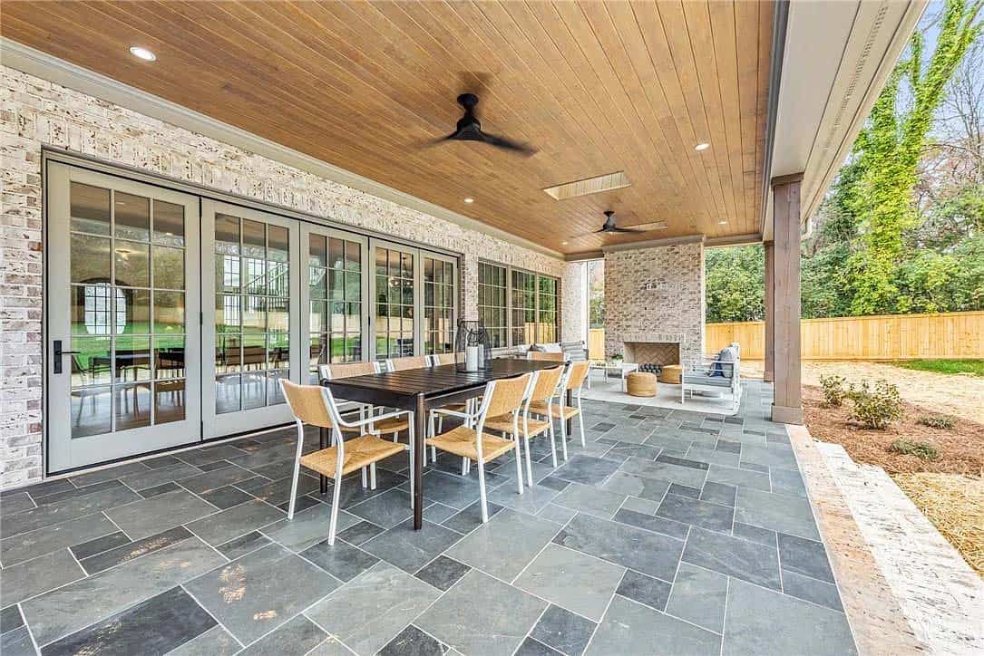 transitional-style-covered-porch-with-a-dining-area