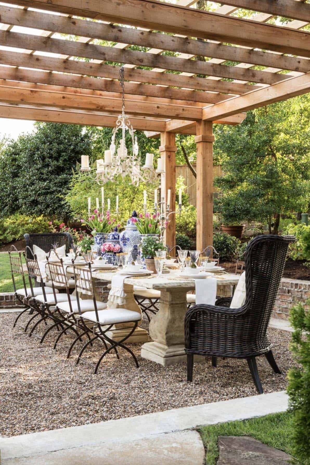 traditional-patio-with-a-pergola-outdoor-dining-and-chandelier