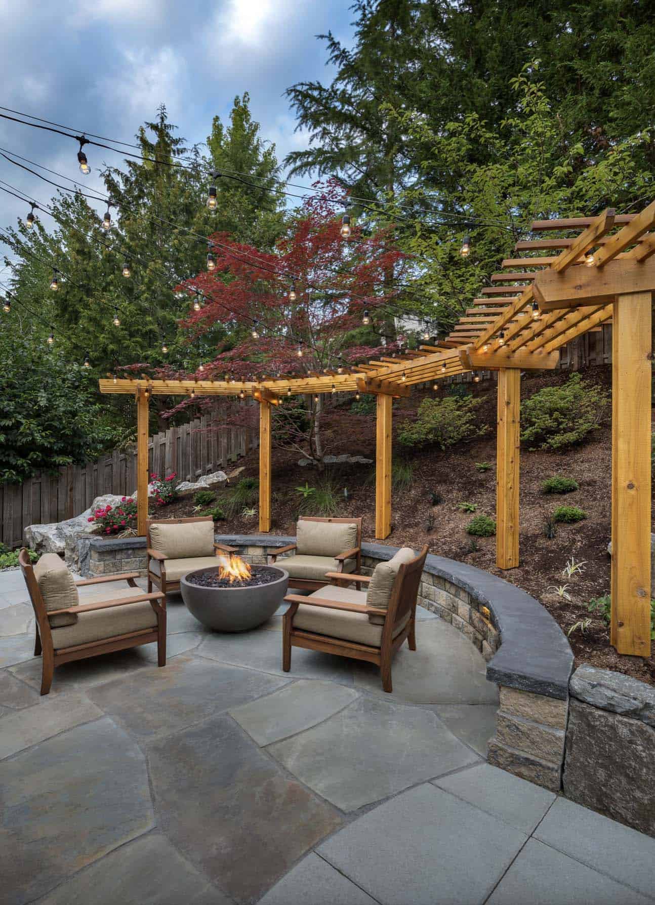 transitional-backyard-patio-with-a-curved-pergola-and-fire-pit
