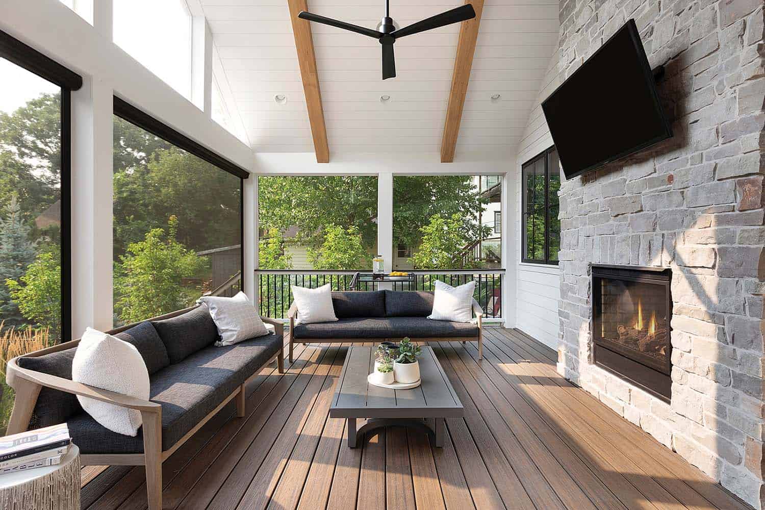 coastal-inspired-modern-farmhouse-screened-porch-with-a-fireplace