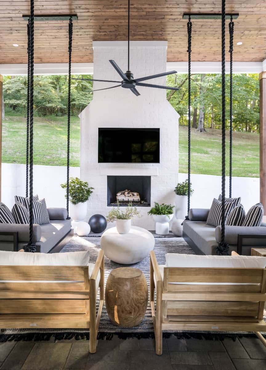 contemporary-coastal-style-covered-patio-with-a-fireplace