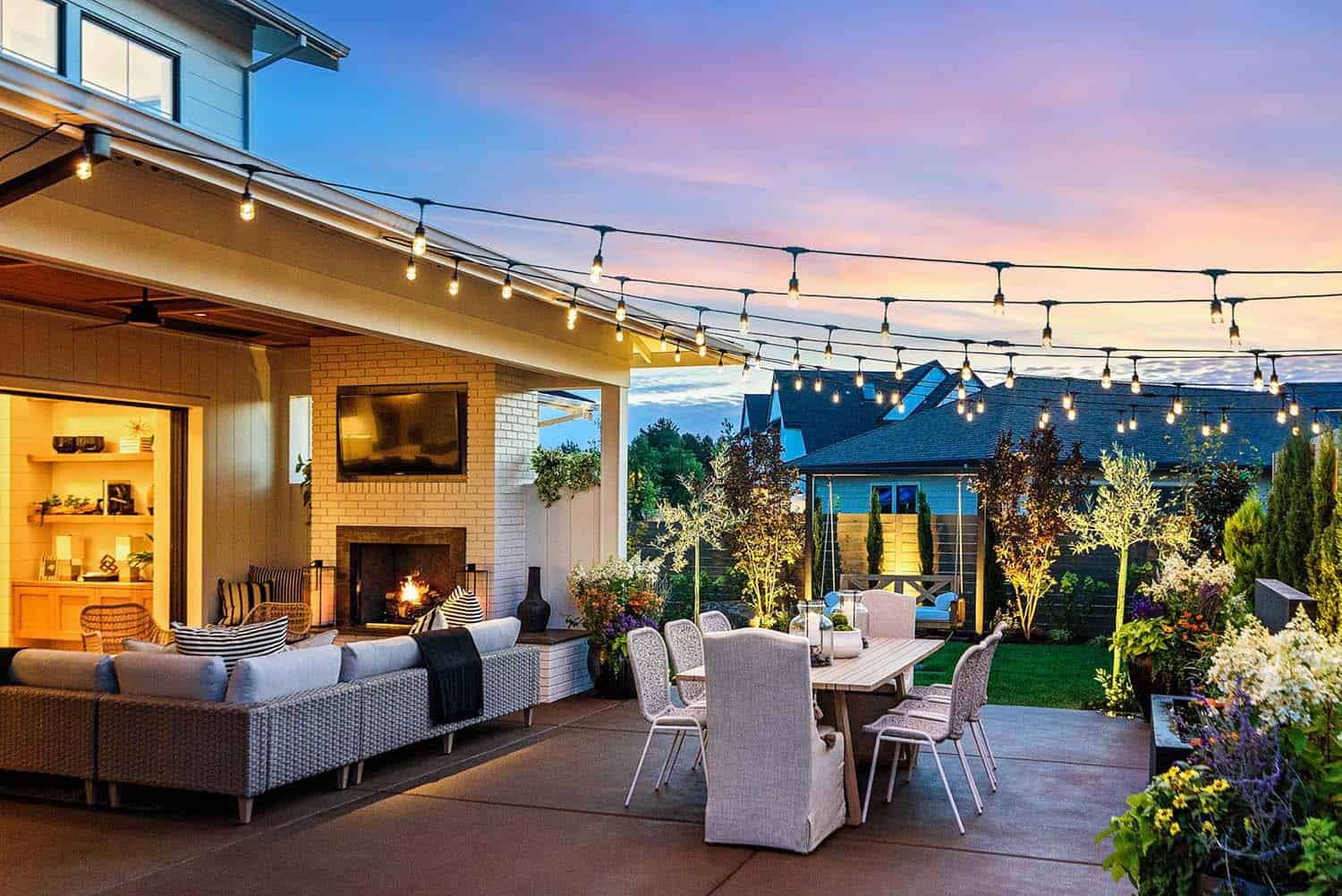backyard-patio-with-outdoor-dining-and-string-lights
