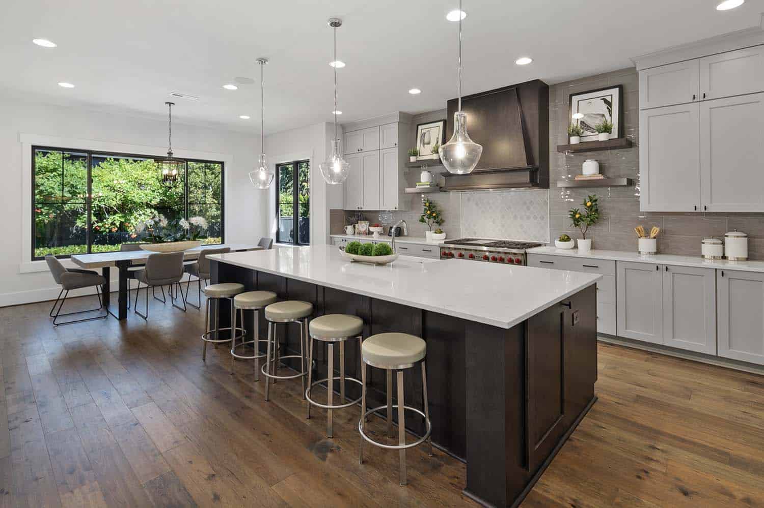 open-concept-kitchen-with-tuxedo-cabinet-style-and-casual-eating-nook