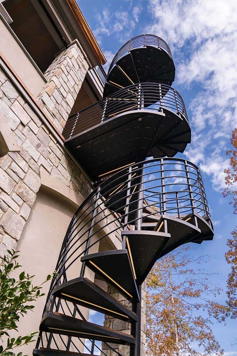 rustic-lake-house-exterior-with-a-spiral-staircase
