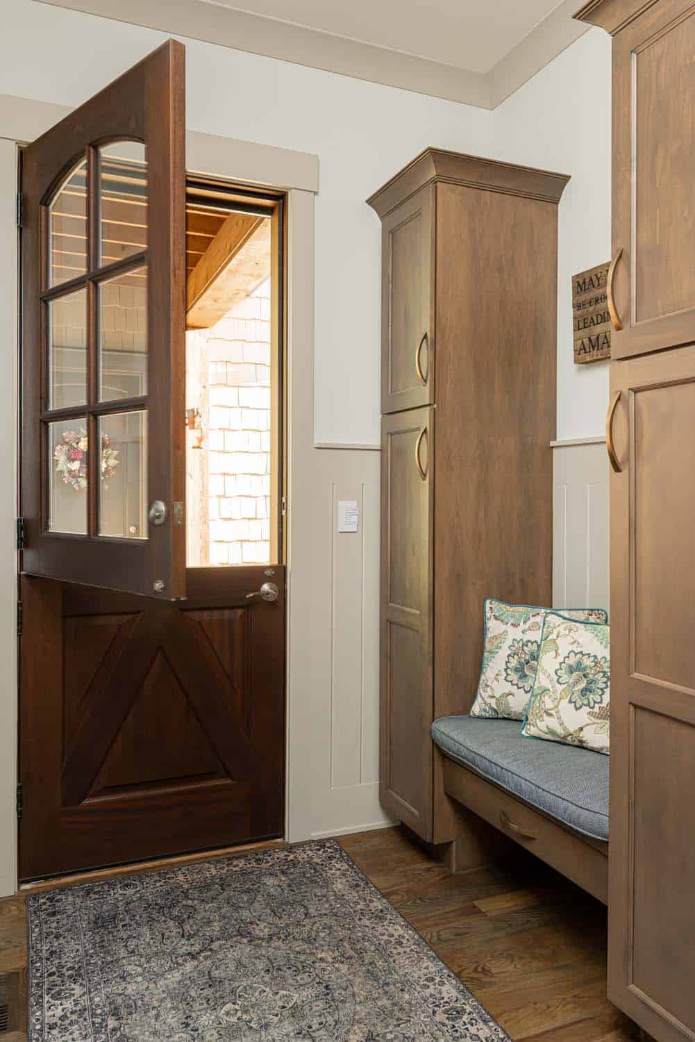 transitional-mudroom-entry-with-a-built-in-bench-and-dutch-door