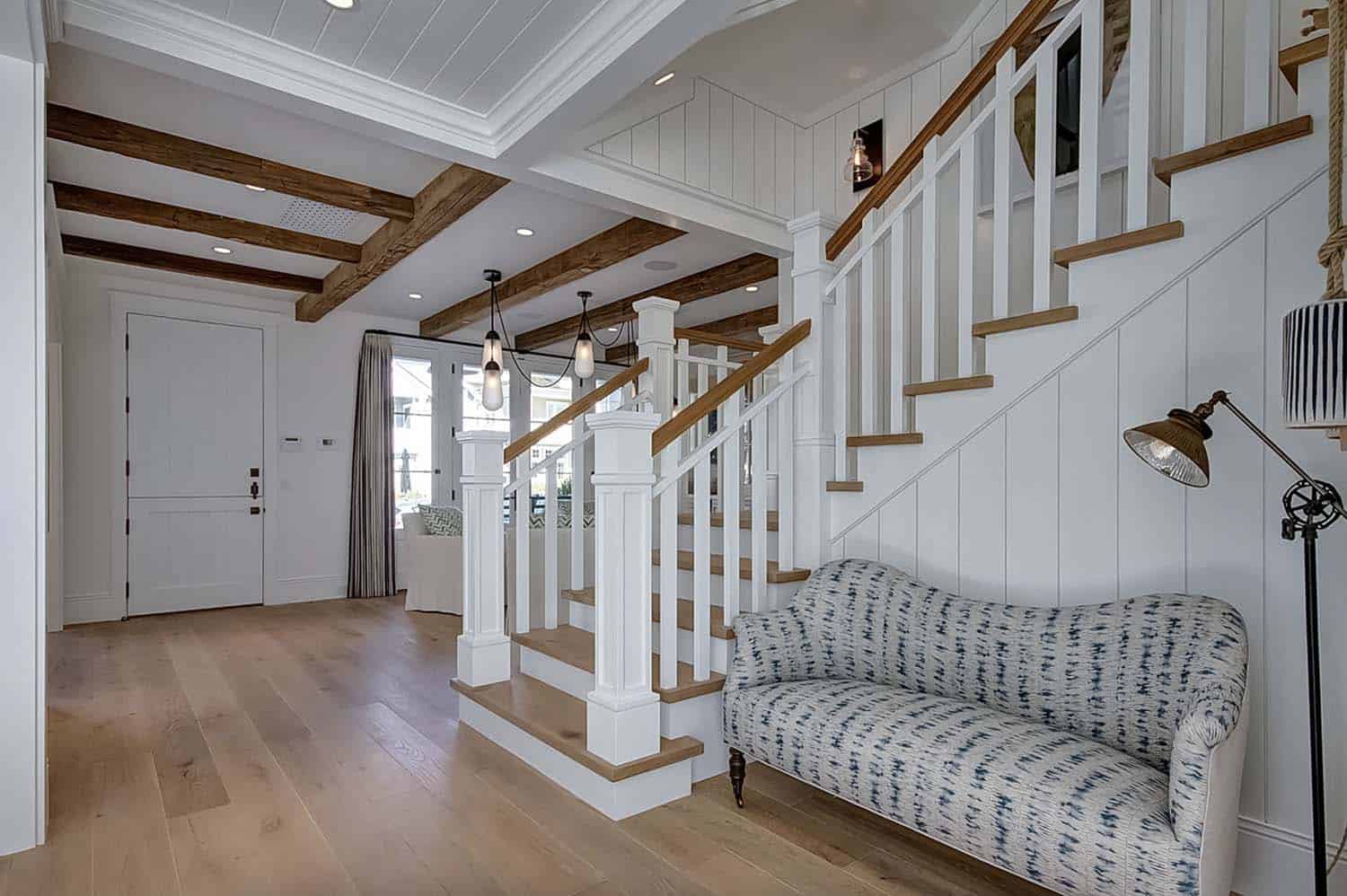 beach-style-home-entry-with-a-staircase