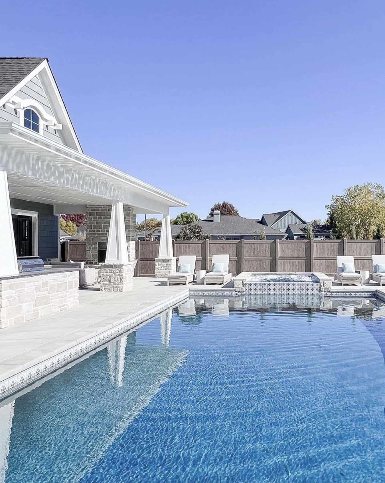 coastal-craftsman-style-home-backyard-with-a-pool