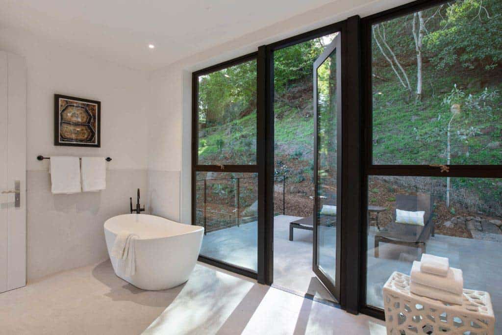 contemporary-bathroom-with-a-freestanding-tub-and-glass-doors-to-a-private-patio