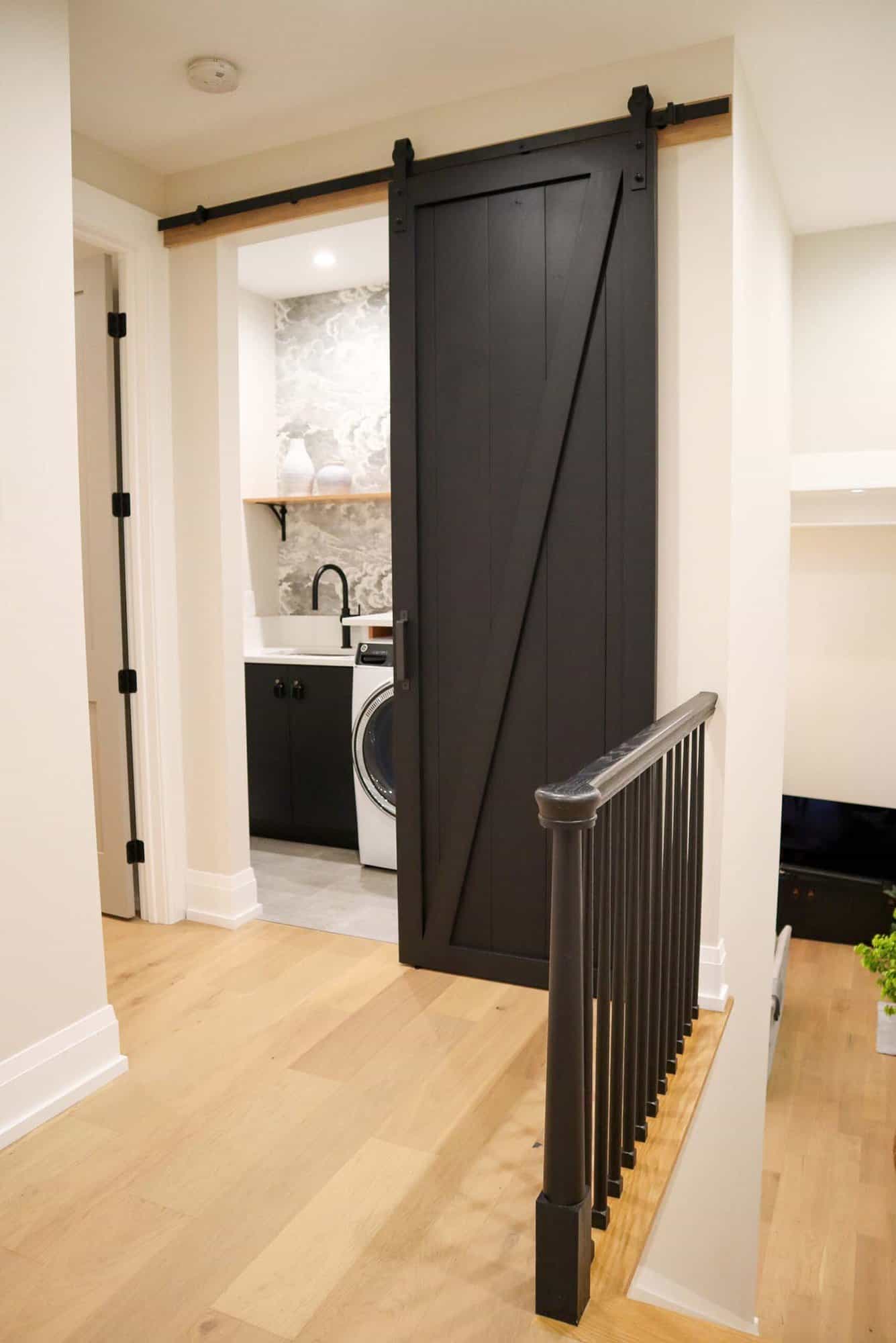 contemporary-laundry-room-with-a-sliding-barn-door