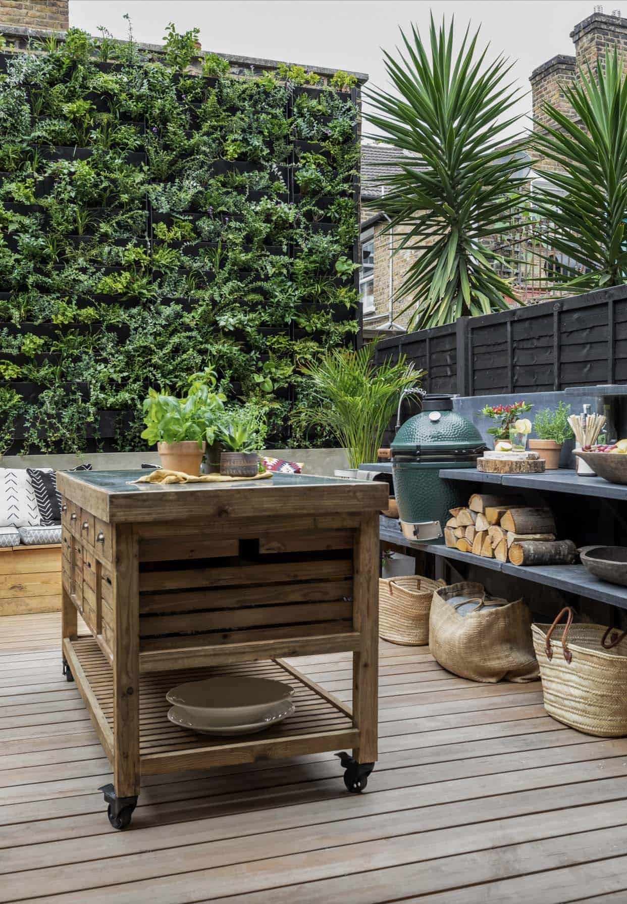 backyard-deck-with-an-outdoor-kitchen-and-green-wall