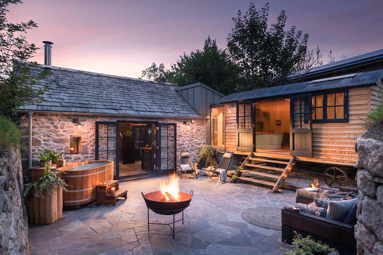 stone-cottage-courtyard-with-a-fire-pit-at-dusk