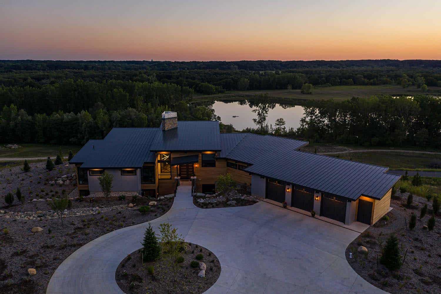 modern-mountain-home-exterior-aerial-view-at-dusk