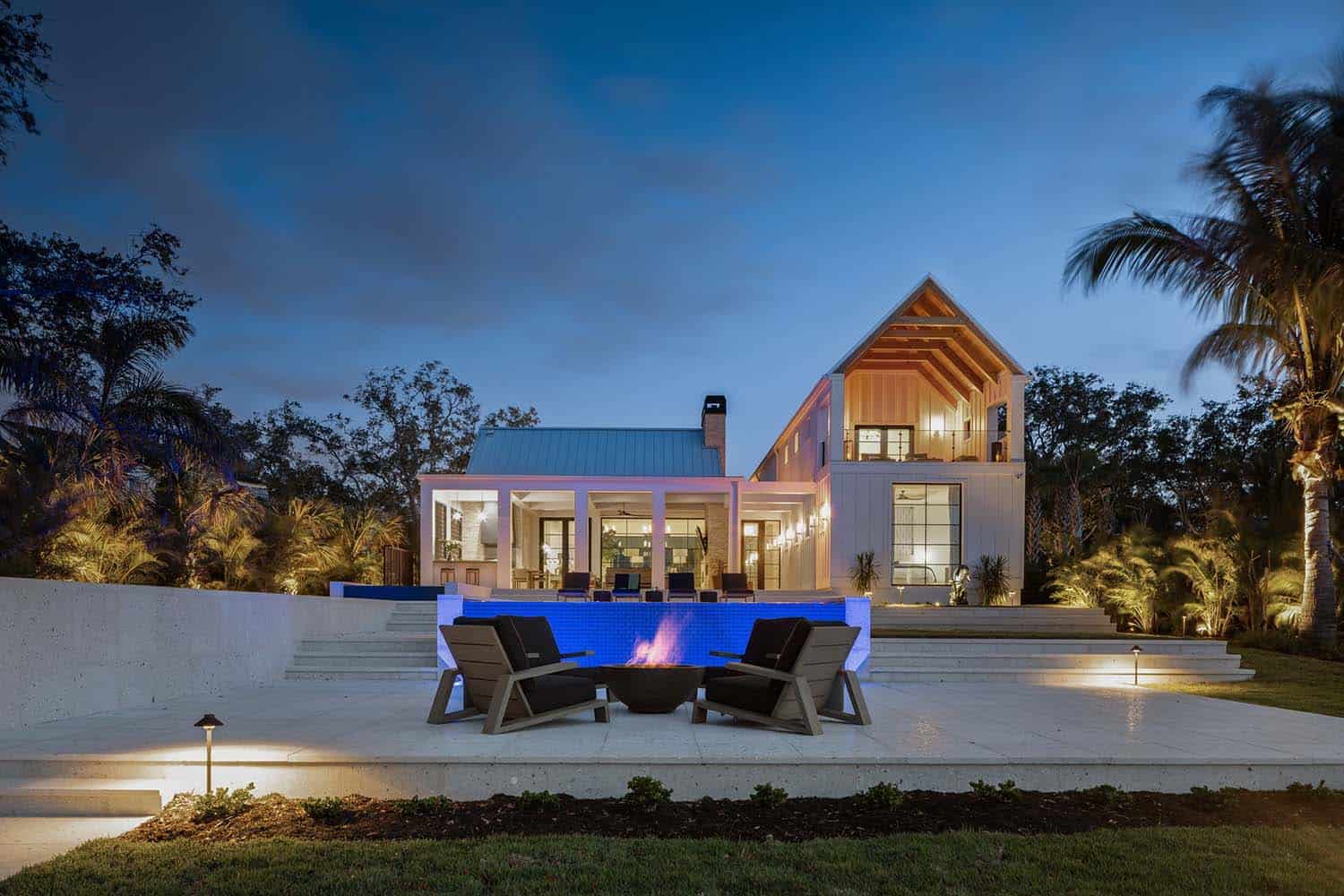 modern-river-house-patio-with-a-fire-pit-at-dusk