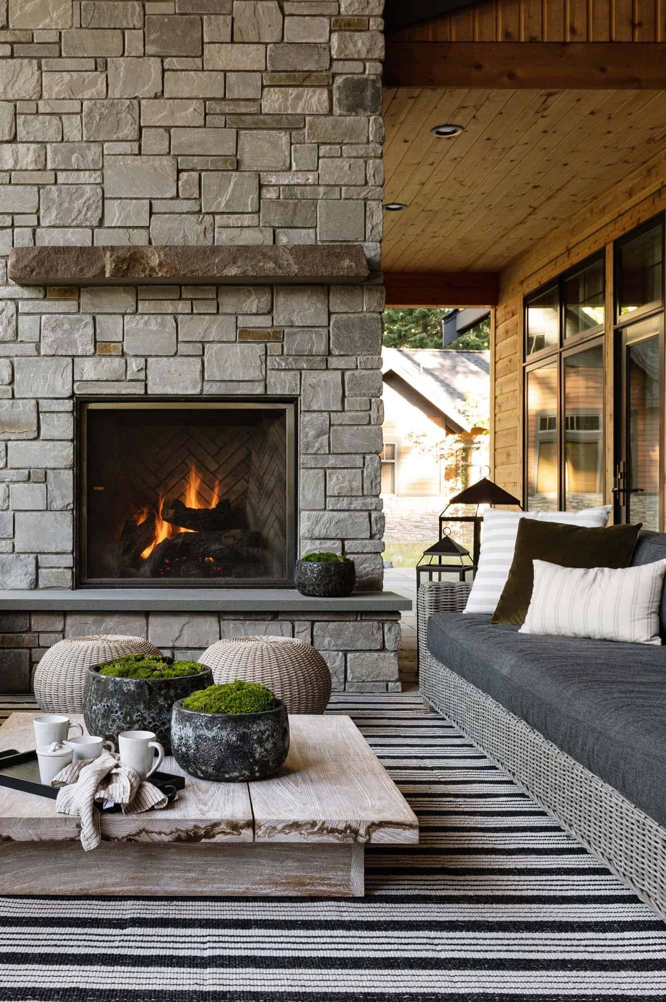 mountain-dream-home-outdoor-patio-with-a-fireplace