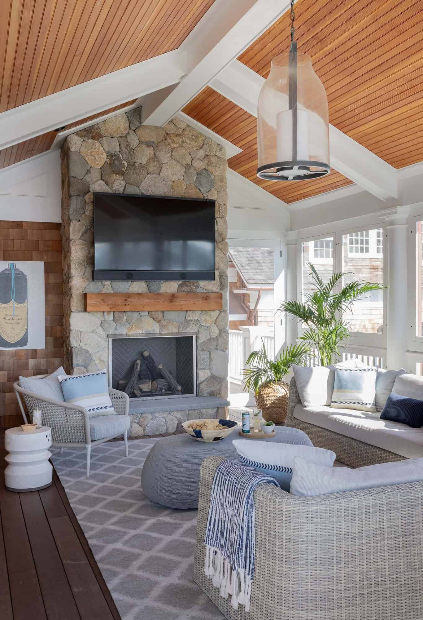 beach-style-sunroom-with-a-fireplace
