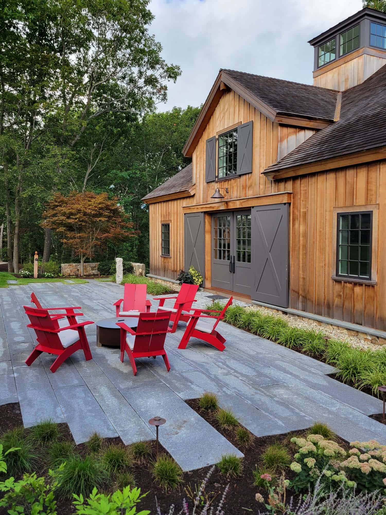 entertainment-barn-patio-wtih-red-adirondack-chairs