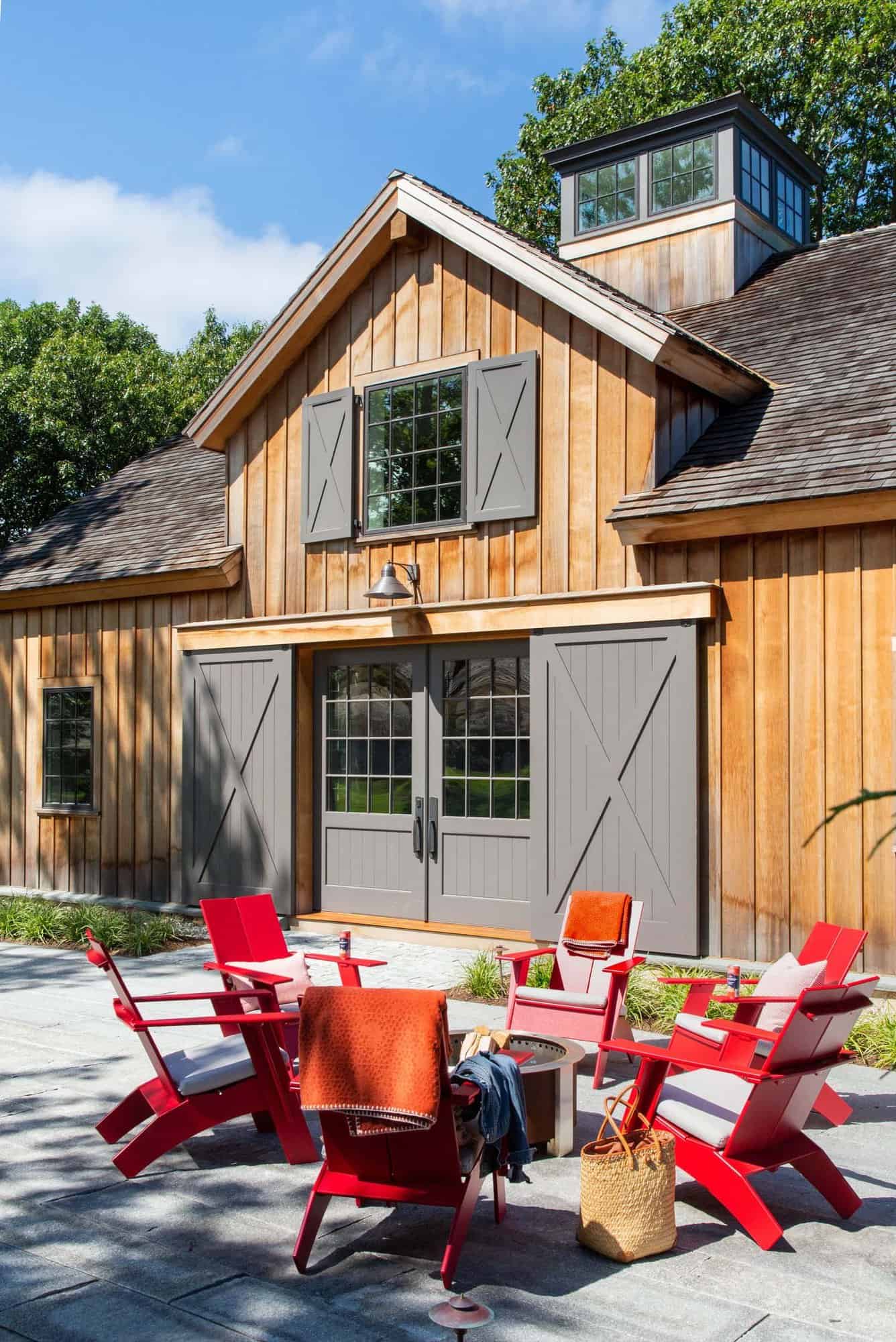 entertainment-barn-patio-wtih-red-adirondack-chairs