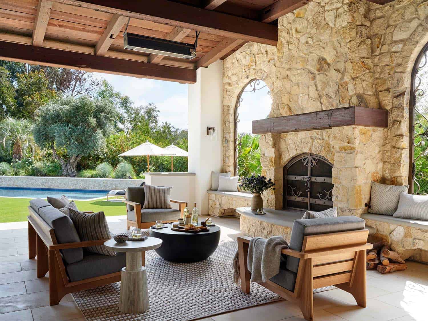 spanish-style-covered-patio-with-a-fireplace