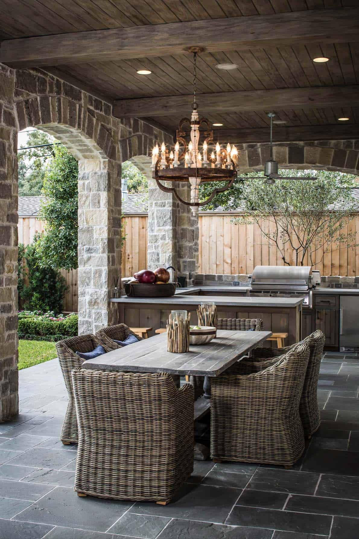 traditional-covered-patio-with-outdoor-dining-and-a-grill
